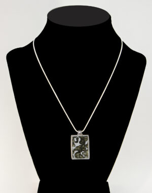 Sericho Pallasite Meteorite Pendant featuring Olivine Crystals.